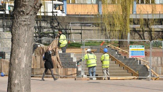 Workmen installing the new steps