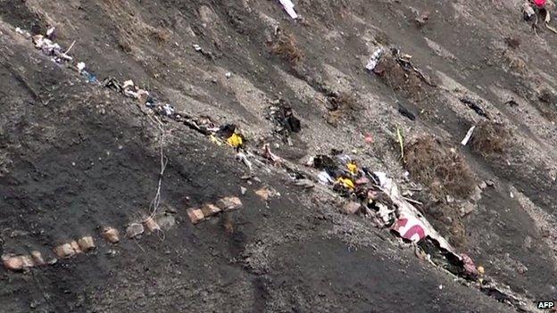 Debris from the crash spread across mountainside