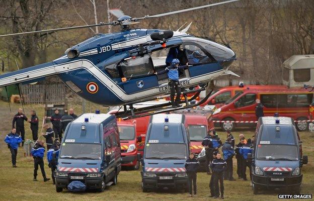 Helicopter with worker leaning out