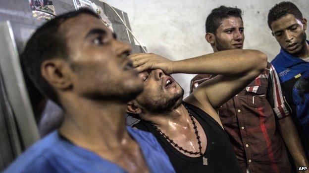 Relatives mourn Palestinian children killed by explosion in Shati refugee camp, Gaza, on 28 July 2014