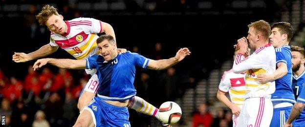 Christophe Berra (19) rises above the Northern Ireland defence to score the only goal of the game