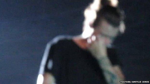 Harry wipes away tears on stage