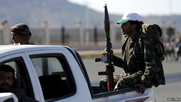 Houthi fighters ride a patrol truck in Sanaa March 25, 2015