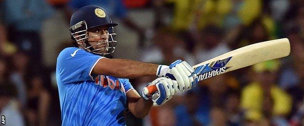 Mahendra Singh Dhoni plays a shot off Australia's Mitchell Johnson