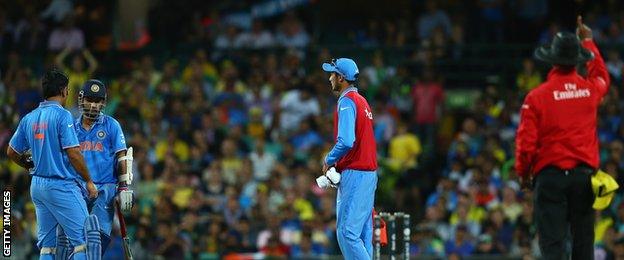 Ajinkya Rahane of India looks dejected as his is given out by Umpire Kumar Dharmasena after a DRS referral