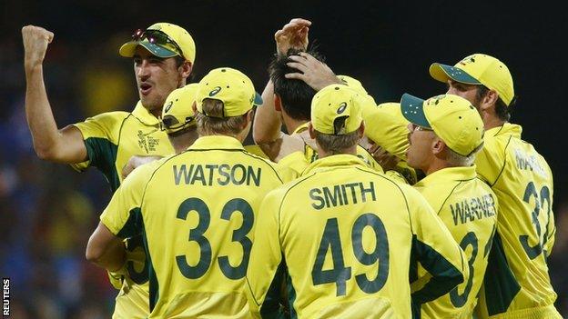 Mitchell Starc (L) celebrates with team mates