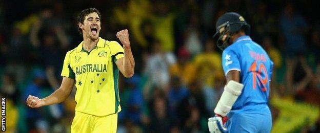 Mitchell Starc of Australia celebrates dismissing Umesh Yadav