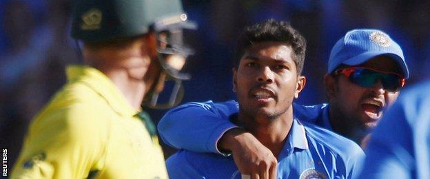 India bowler Umesh Yadav (centre) looks at Australian batsman Aaron Finch