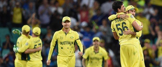 Michael Clarke (centre) walks across the SCG pitch as his team-mates celebrate