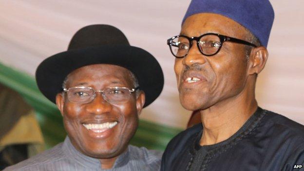 Nigerian President Goodluck Jonathan (L) and APC main opposition party"s presidential candidate Mohammadu Buhari (R) smile after signing the renewal of the pledges for peaceful elections on March 26, 2015 in Abuja.