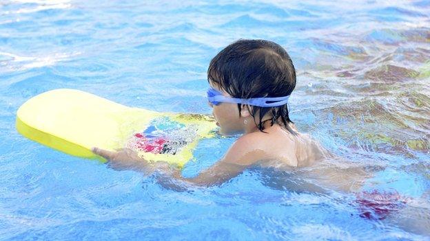 Boy learning to swim