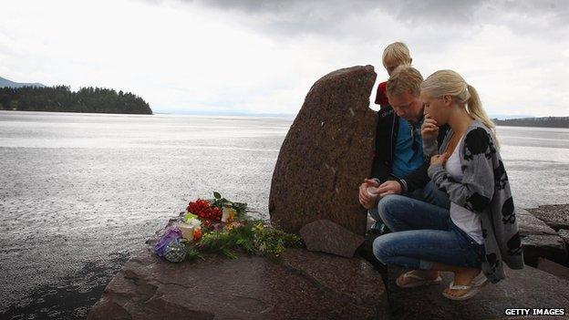 Members of the public pay their respects near Utoya island following the attacks by Anders Behring Breivik, July 24, 2011