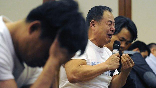 File photo: A Chinese relative of passengers on the missing Malaysia Airlines flight MH370 reacts as he attends a meeting at the Metro Park Hotel in Beijing, 21 April 2014