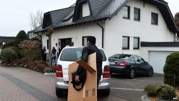 Investigators outside co-pilot's house