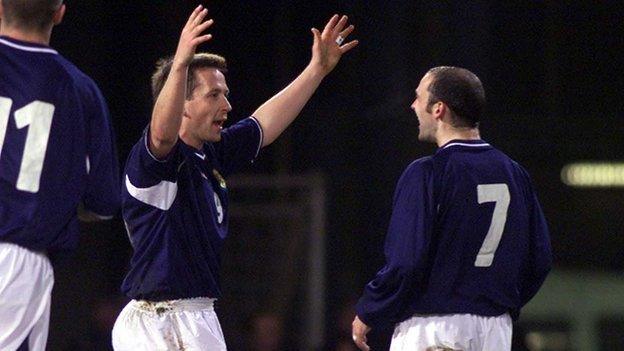 Billy Dodds (left) celebrates scoring against San Marino