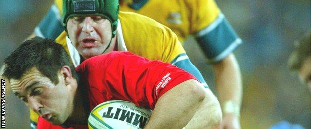 David Lyons tackles Wales' Jonathan Thomas in June, 2003