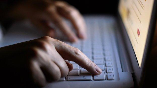 Person using a computer keyboard