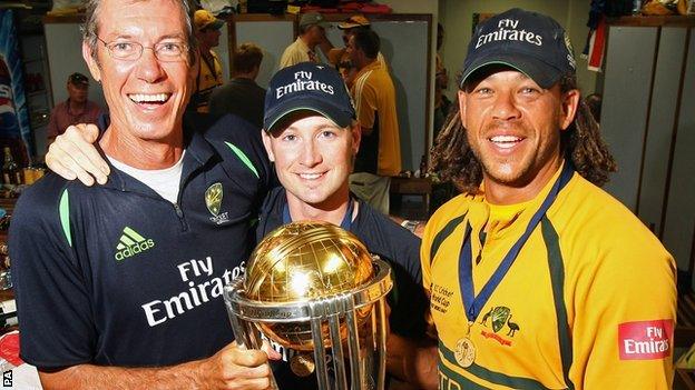 John Buchanan (left) holds the Cricket World Cup trophy with Michael Clarke and Andrew Symonds