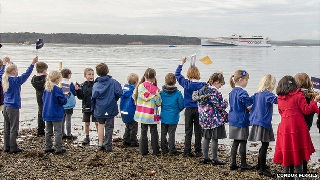 Children from Courthill Infant School and well-wishers gather at Baiter Park to wave off Condor Liberation on her maiden voyage