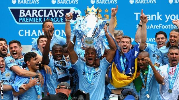 Manchester City with the Premier League trophy