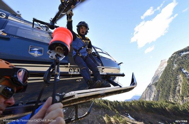 French police on a helicopter near the crash site, 27 March