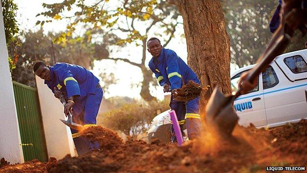 Liquid Telecom workers laying cable