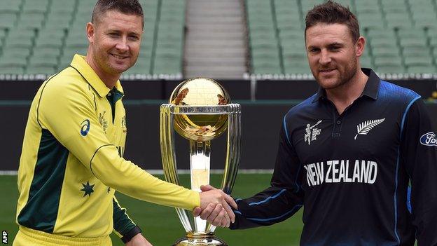 The two captains, Michael Clarke and Brendon McCullum, pose with the World Cup trophy