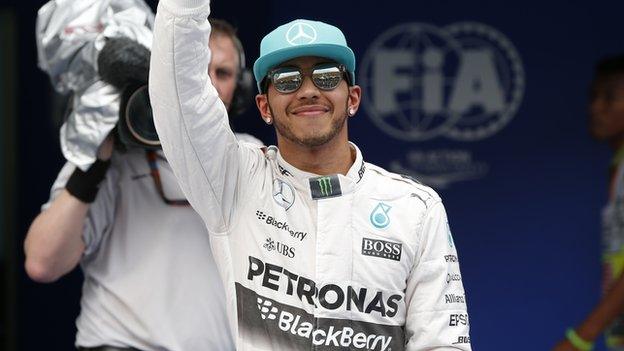 Lewis Hamilton celebrates qualifying in pole position