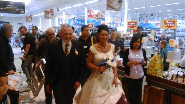 Rebecca Wooller and Blake Green exiting after getting married in Morrisons