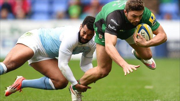 Tom Fowlie of London Irish is tackled by Noah Cato of Newcastle Falcons