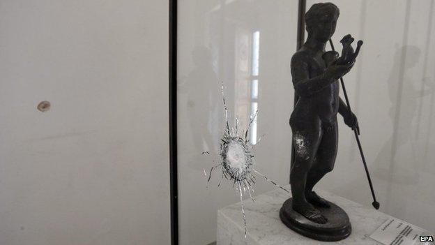 A general view shows a staute and its display case damaged when gunmen opened fire on visitors to the National Bardo Museum, Tunis, Tunisia