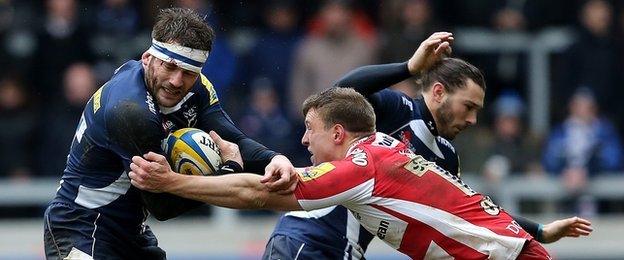 Sale's Mark Cueto is tackled by Gloucester's Brendan Macken