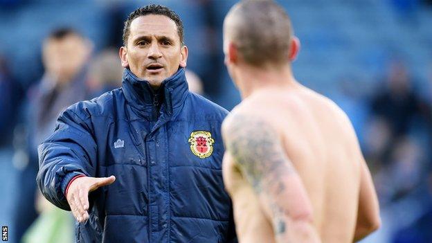 Gibraltar interim head coach David Wilson congratulates Scotland captain Scott Brown