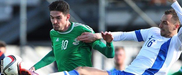 Northern Ireland's Kyle Lafferty in action against Sakari Mattila of Finland