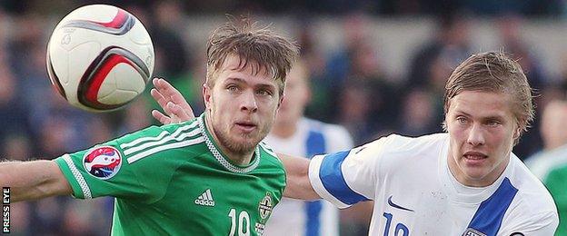 Northern Ireland's Jamie Ward competes against Jere Uronen of Finland