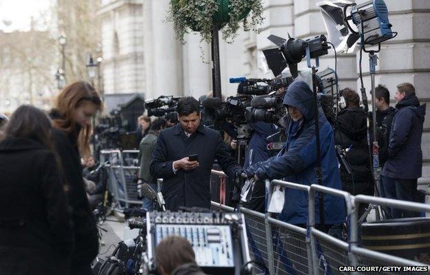 Members of the media gather in Downing Street