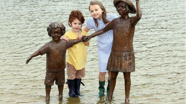 Megan Phillips and Victor Groves with sculpture at Wicksteed Park