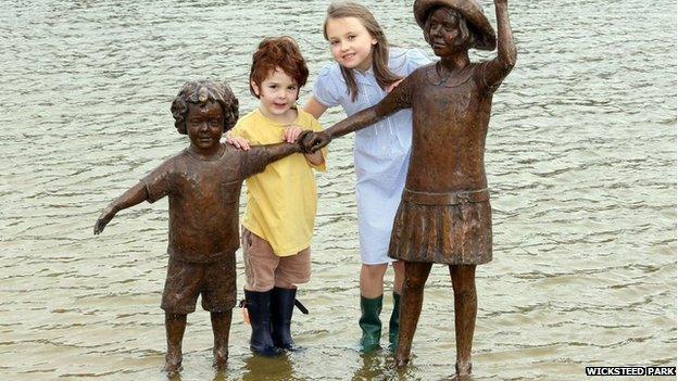 Megan Phillips and Victor Groves with sculpture at Wicksteed Park