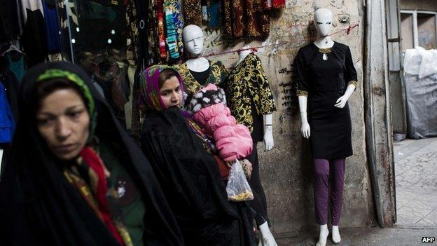 Iranian women wander as they shop at Tehran"s grand bazaar