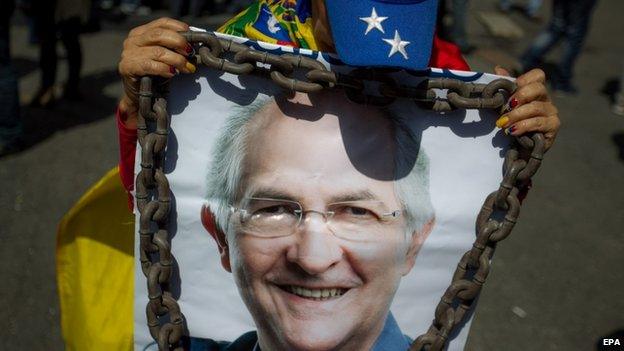 A woman holds up a poster with a picture of Mr Ledezma at a protest in Caracas on 20 February 2015.