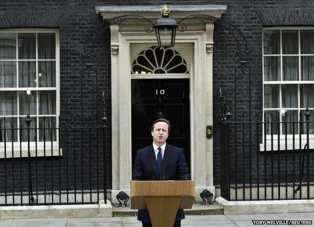 Britain's Prime Minister David Cameron speaks as he returns to Number 10 Downing Street