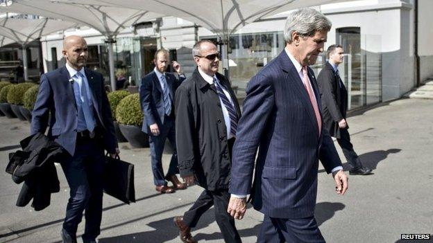 US Secretary of State John Kerry walks walks to the Beau-Rivage Palace hotel in Lausanne, Switzerland (30 March 2015)