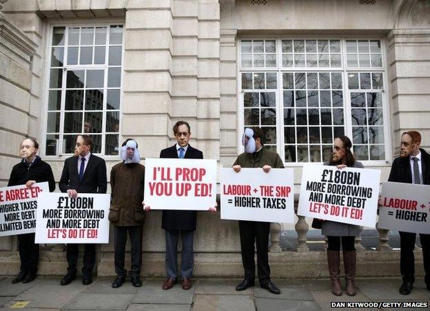 Demonstrators stand outside Bloomberg LP's European headquarters