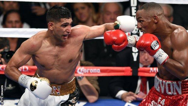 Amir Khan (left) in action against Devon Alexander