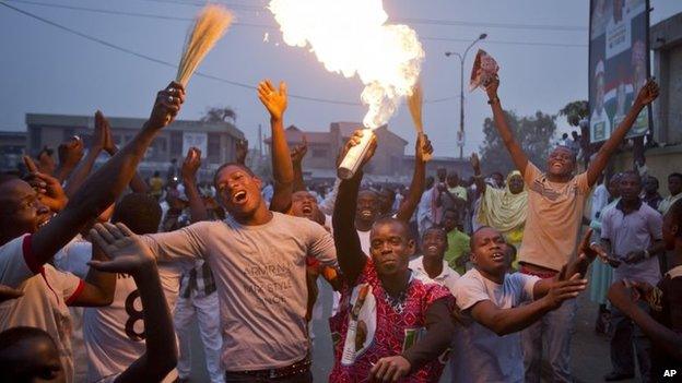 Supporters of opposition candidate Muhammadu Buhari celebrate an anticipated win for their candidate, in Kano, Nigeria on 31 March 2015.