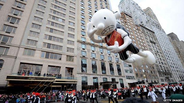 An inflatable Diary of a Wimpy Kid figure is flown at the Thanksgiving Day parade in New York