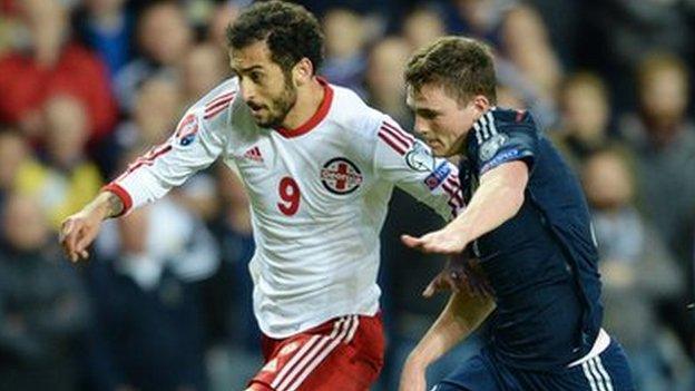 Scotland's Andrew Robertson (right) battles with Nikoloz Gelashvill