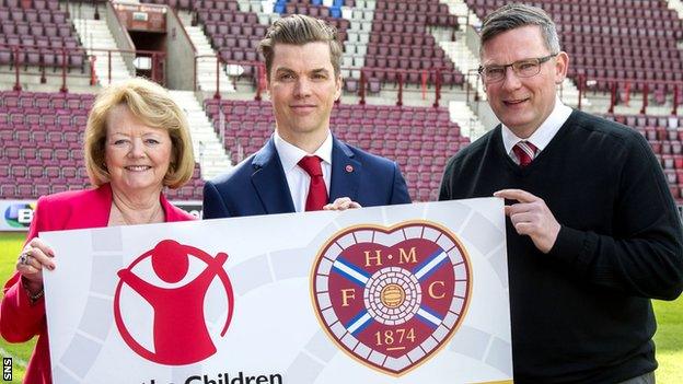 Ann Budge (left) and Craig Levein (right) join Save the Children's Neil Mathers to announce the new deal