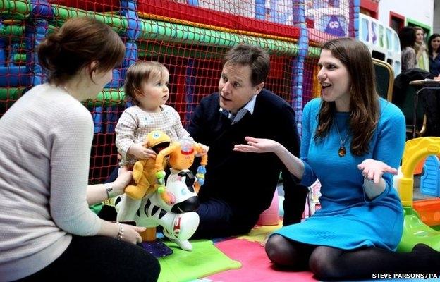 Liberal Democrats leader Nick Clegg alongside Jo Swinson at Playtown in Bishopbriggs, East Dunbartonshire