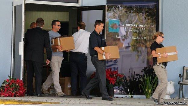 Law enforcement agents raid the office of Dr Salomon Melgen in West Palm Beach, Florida on 30 January 2013